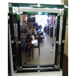 A 20thC Italian inspired ebonised and green tinted mirror, the two tier,