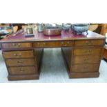 A mid 20thC Victorian design mahogany partners desk,