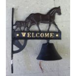 A painted iron novelty door bell, fashioned as a horse and foal,