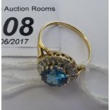 A 9ct gold ring, set with a blue topaz,