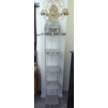 A modern cream painted metal pagoda style,