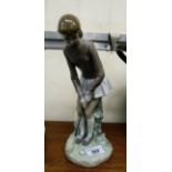 A Lladro porcelain figure 'The Lady Golfer' 10.