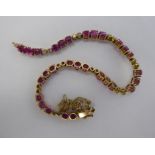 A 9ct gold ruby and diamond tennis bracelet 11