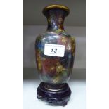 A 20thC cloisonne vase with a flared lip, slender neck and tapered body,