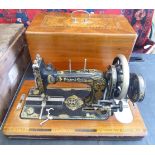 An early 20thC Frister & Rossmann manual sewing machine, decorated in Art Nouveau style with flora,