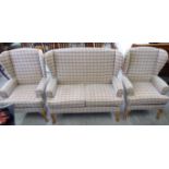 A modern three piece suite, comprising a two person settee and two armchairs, the textured,