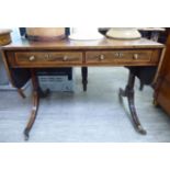 An Edwardian crossbanded ebony and string inlaid mahogany sofa table with two frieze drawers and