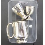 Silver collectables: to include a tankard of squat, bulbous form with a C-shaped handle,