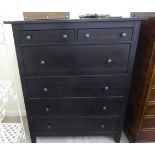 A modern black painted dressing chest with two short/four graduated long drawers,