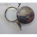 A white metal pendant locket,