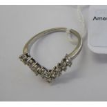 A white metal Herringbone design ring,