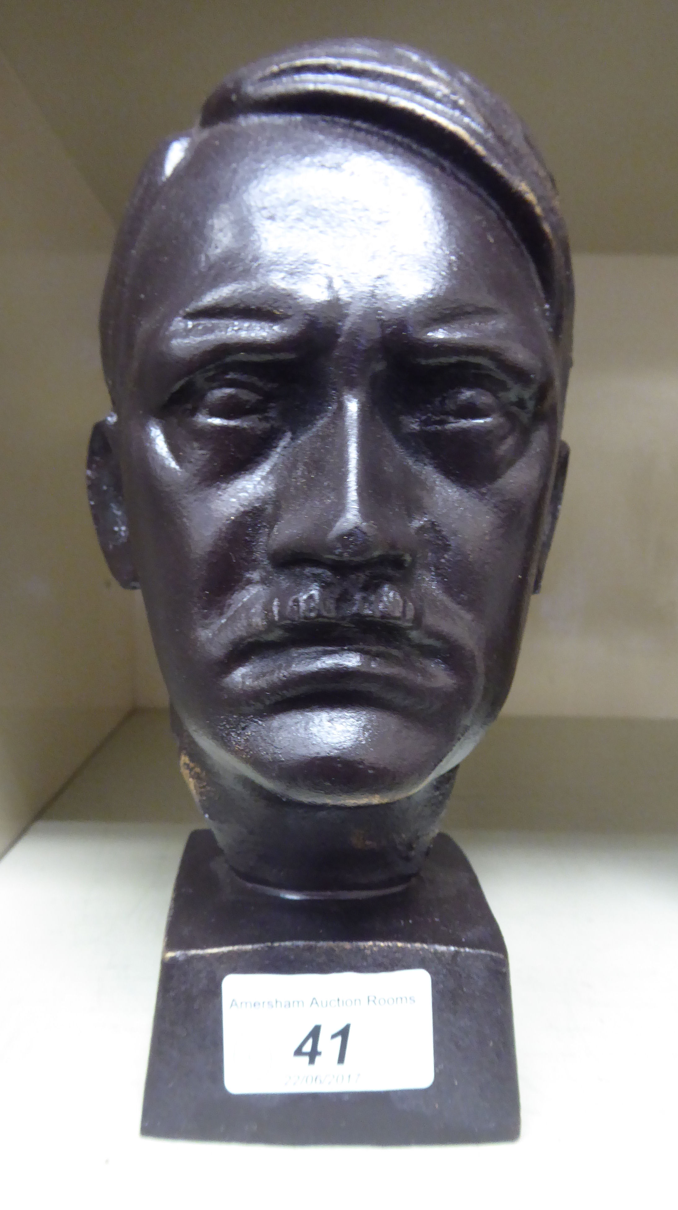 A modern cast and patinated iron bust 'Hitler', on a square,