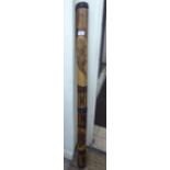 A softwood didgeridoo with applied strapwork CA