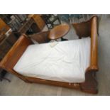 An early 20thC French inspired burr walnut framed single sleigh bed with a mattress 44''w LAM