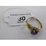 A 9ct gold ring, set with an amethyst,