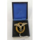 A reproduction of a cast metal German Luftwaffe pilot/observer breast badge stamped JMME boxed