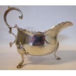 A late Victorian silver sauce boat with a decoratively cut,
