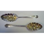 A matched pair of George III silver Old English pattern berry spoons indistinct London makers'