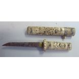 An early 20thC Japanese dagger with a carved bone handle the blade 5.