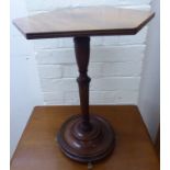 A late 19thC mahogany wine table, having an hexagonal top, over a turned column,