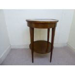 An Edwardian walnut hall table, the radiating, segmented veneered top raised on square,