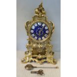 A late 19thC French floral and foliate cast gilt metal cased mantel clock,