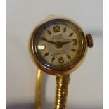 A Sigma 18ct gold round cased wristwatch, on an integral, flexible, sprung bracelet,