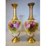 A pair of Royal Worcester china, ovoid shaped, pedestal vases with long narrow, waisted necks,