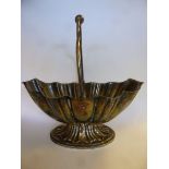 A late Victorian silver sugar basket of concentrically reed moulded, oval form with a swing handle,