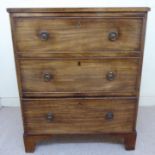 An early 19thC mahogany bedside chest, the top having an applied moulded edge,