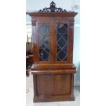 A mid Victorian figured mahogany cabinet bookcase,