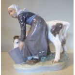 A Royal Copenhagen porcelain model 'Girl with a Calf' by C Thomsen, no.779 6.
