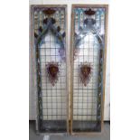A pair of 19thC Continental oak framed, stained and painted leaded glass window panels,