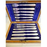 A set of six Edwardian silver dessert knives and forks,