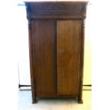 An early 20thC Continental light oak cupboard, the straight,