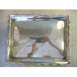 An Edwardian silver dressing table tray with a flared,