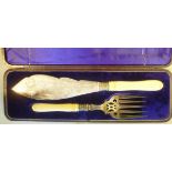 A pair of Edwardian engraved silver plated fish servers,
