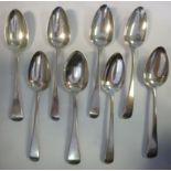 A matched set of eight early 19thC silver Old English pattern dessert spoons mixed marks