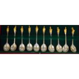 'The Queen's Beasts' a set of ten silver spoons, the fig shaped bowls on tapered stems with cast,