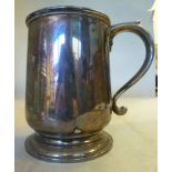 A silver one pint tankard with an applied wire rim and a tab-top, hollow S-scrolled handle,