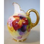 A Royal Worcester china ovoid shaped cream jug, having an upstand pouring lip and a loop handle,