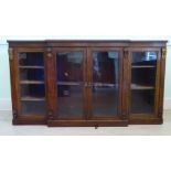 An early 19thC mahogany breakfront dwarf, cabinet bookcase with applied gilt metal beading,