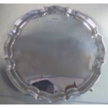 A Georgian style silver salver with a raised piecrust border,