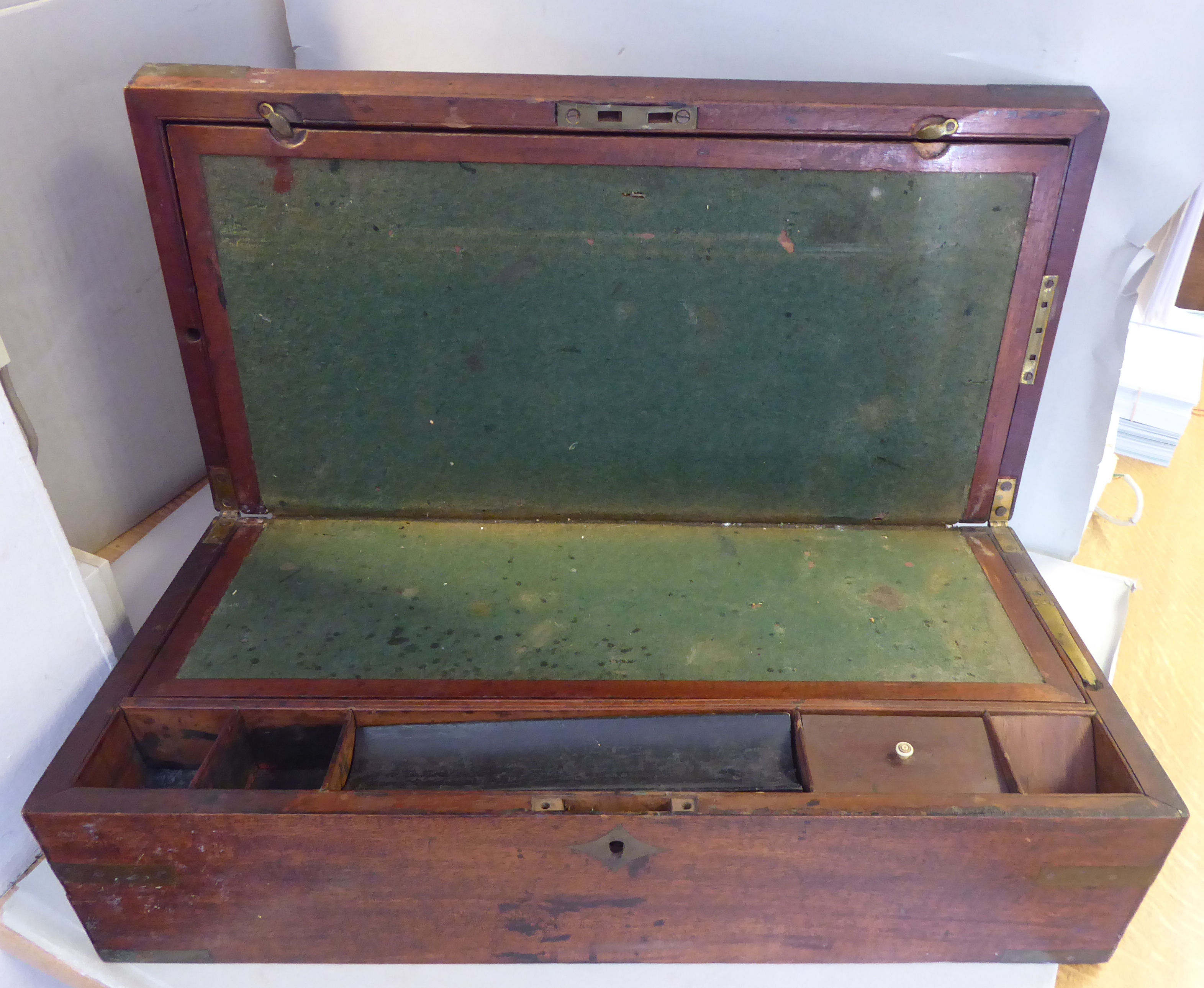 A late Victorian military design brass inlaid mahogany writing box,