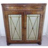 A Regency mahogany side cabinet, the top having round corners,
