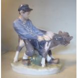 A Royal Copenhagen porcelain model 'Boy with Calf' by C Thomsen, no.