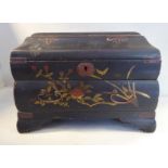 An early 20thC Japanese black lacquered and overpainted jewellery casket,