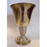 A silver goblet, the bell shaped cup on a decoratively cast,