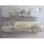A pair of 20thC Japanese porcelain rectangular block pillows,