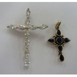 Two silver pendant crosses, one set with blue stones,